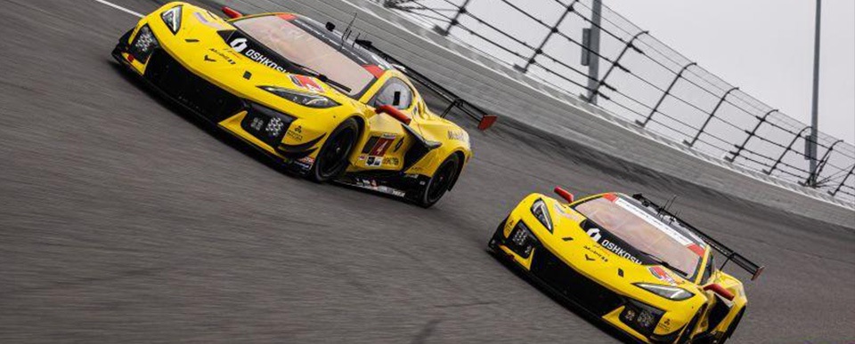 Two yellow Corvettes racing